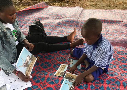 A child learning with a facilitator