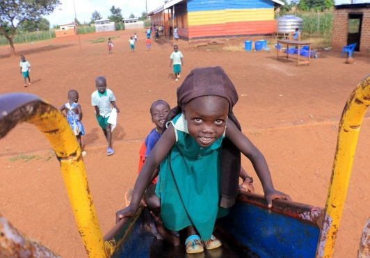 Child using playground equipment